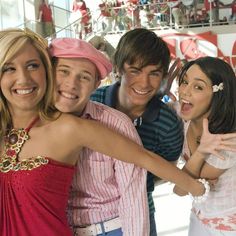 the young people are posing together for a photo in front of christmas decorations and candy canes