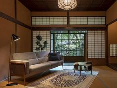 a living room filled with furniture and a large window