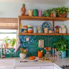 the kitchen counter is covered with pots, pans, and other decorative items that are on shelves