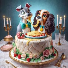 a cake with two dogs on top of it sitting on a table next to candles