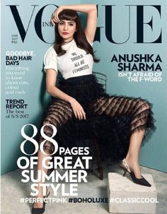 a woman sitting on top of a chair wearing a white shirt and black tulle skirt