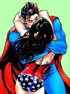 superman and wonder woman hugging each other in the air with their arms around each other