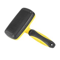 a yellow and black brush on a white background with clippings for the handle