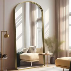 a living room with a couch, chair and large gold mirror in it's corner