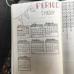 an open notebook with a calendar on it and the words period tracker written in red