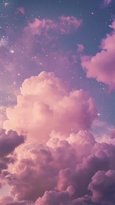 the sky is full of stars and clouds in it's pink hued colors