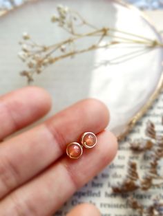 Tiny Sunstone Stud Earrings 14K Gold Filled, Rose Gold Filled, Sterling Silver Wire Wrapped Gemstone Earrings• Gemstone Size: 4 mm💖 Handmade with genuine natural Sunstone beads and choice of 14K gold-filled, Rose Gold Filled or Sterling Silver.✨ Sunstone is a lucky stone that brings light & healing energy of the sun. Wearing sunstone jewelry is believed to bring enjoyment & vitality to your life & the world around you. ✨• 14K gold-filled and sterling silver are known for their lasting quality. Sunstone Earrings, Light Healing, Sunstone Jewelry, Lucky Stone, Earrings Gemstone, Sterling Silver Wire Wrap, Earring Cards, Healing Energy, Polish Jewelry