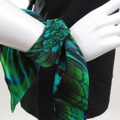 "This flirty little 16\" mini scarf is just big enough to add a sophisticated accent to your outfit without bulk. \"Reaction\" is a Fractal design in brilliant green. Bright colors in art-to-wear on very high quality silk satin tiny scarf with a hand-rolled hem. * Digitally printed original design * 100% silk satin * Approx. 16\" square * Hand-rolled hem * Dry clean or hand wash in cold water * Ironing OK. Use of press cloth recommended. * Arrives packed in an elegant gift-box IMPORTANT SIZING N Green Silk Scarf For Party, Green Silk Scarves For Formal Occasions, Elegant Green Scarves For Spring, Formal Green Silk Scarves, Trendy Green Silk Scarf Gift, Trendy Green Scarves As Gift, Trendy Green Scarves For Gift, Trendy Green Scarves For Gifts, Trendy Green Scarf For Gift