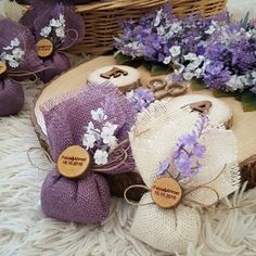 lavender flowers are sitting on the floor next to some burlocks and twine bags