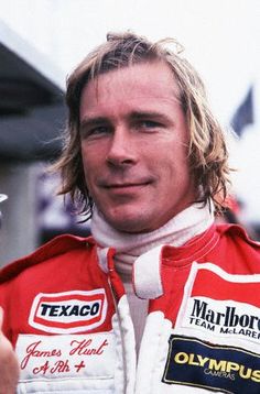 a man in a red and white racing suit