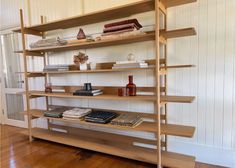 a wooden shelf with books and other items on it