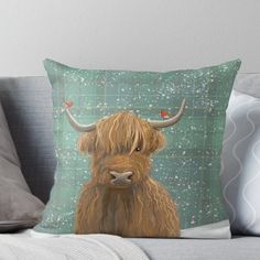 a scottish highland cow with long horns and birds on it's head throw pillow