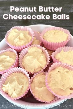 a bowl full of peanut butter cheesecake balls on top of a wooden table with text overlay