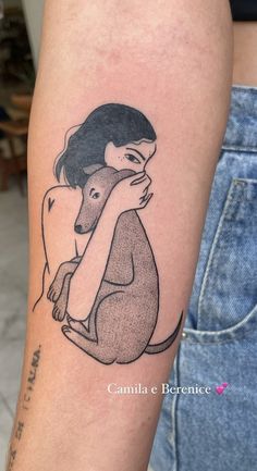 a woman with a dog on her arm is shown in black and white tattoo style