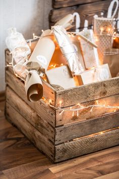 a wooden crate filled with lots of wrapped presents