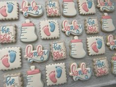 baby shower cookies are displayed on a table