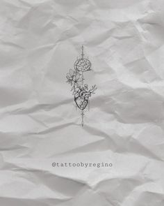 an ink drawing on white paper with the words tattoo by regino