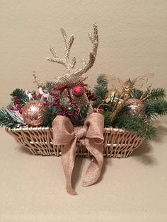 a basket filled with christmas decorations on top of a table