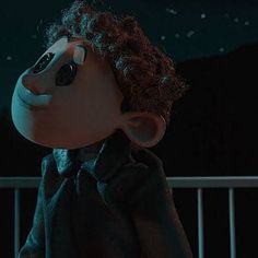 an animated character with curly hair standing in front of a balcony at night, wearing a black shirt and tie