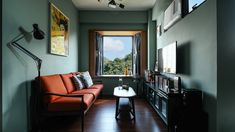 a living room filled with furniture and a large window