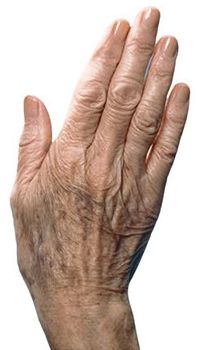 an old man's hand with wrinkles on it