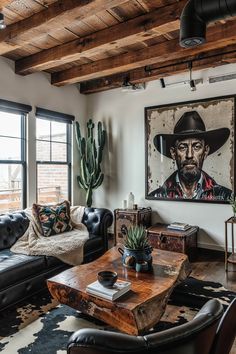 a living room filled with furniture and a painting on the wall