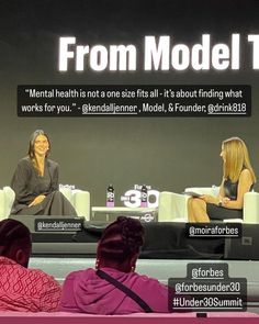 two women sitting on couches in front of a screen with the words from model t