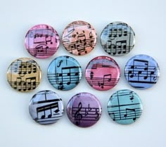 six buttons with musical notes on them are arranged in a circle and have been placed together