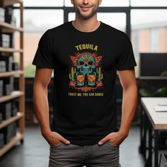 Get ready to dance the night away with our unique Tequila Skull T-Shirt! Perfect for any party, this shirt features a humorous "Trust Me, You Can Dance" slogan paired with a beautifully designed Mexican sugar skull surrounded by vibrant cacti and flowers. The playful design captures the festive spirit of a fiesta and is sure to be a conversation starter at any event. Made from comfortable, high-quality material, it's not just a fun addition to your wardrobe but also a cozy one. Available in vari Tequila Squad Shirts, Drinking Outfit, Day Drinking Outfit, Tequila Humor, Mexican Sugar Skull, Skull Top, Day Drinking, Dusseldorf, Fiesta Party