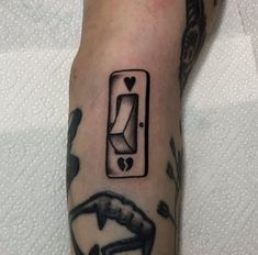 a person with a tattoo on their arm has a light switch and heart in the middle