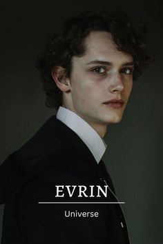 a young man in a black suit and white shirt with the words evrin on it