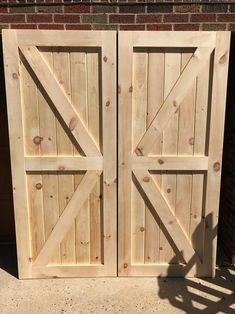 two wooden doors sitting next to each other