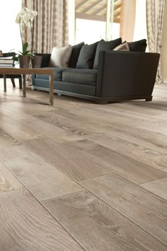 an image of a living room with wood flooring on the walls and in the floors