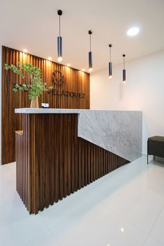 the reception area is clean and ready for guests to use it's marble counter top