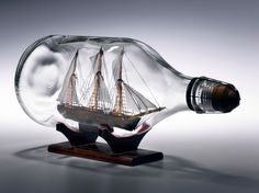 a glass bottle with a ship in it