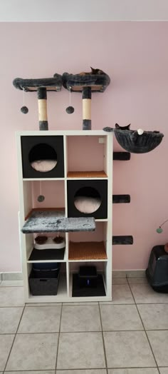 a cat tree in the corner of a room