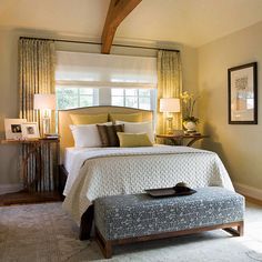 a bedroom with a large bed sitting under a window