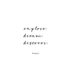 the words explore, dream, discovery are written in black ink on a white background