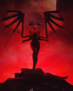 a woman standing on top of a rock next to a giant red dragon flying over her head