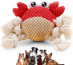 an image of a crab made out of knitted material with dogs in the background