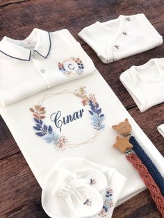 Announce your little baby's arrival with this personalized, baby-name-coming home outfit set.  This gorgeous set is completely hand embroidered by women using the Brazilian embroidery technique. You can keep this high quality set as a lifetime keepsake. You can also gift this set to your loved ones as a very special gift ⭐ Hand Embroidered Coming Home Outfit  Set is made of 100% cotton fabric. ⭐ Soft, stretchy cotton fabric that is breathable. ⭐ Professionally packed garments. Instruction for Pe Customizable White Gift Sets, White Embroidered Gift Sets, Embroidered Baby Clothes, Hospital Newborn, Baby Layette Set, Newborn Clothing, Baby Layette, Newborn Hospital, Geometric Frame