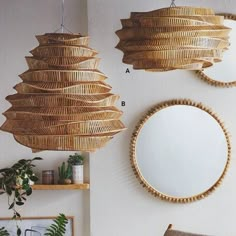 three circular mirrors are hanging on the wall