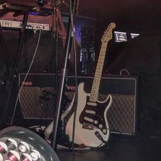 an electric guitar and amp on stage at a concert