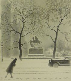 a person walking in the snow near a statue