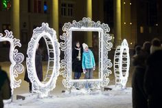 two children are standing in front of an ice sculpture