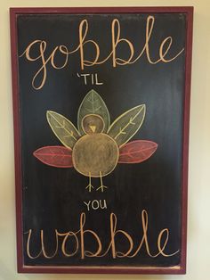 a chalkboard sign that says gobble til you wobble