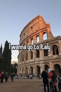 people standing in front of an old building with the words i wanna go to italy