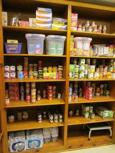 the shelves are full of various food items and containers on them, including canned foods