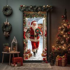 a door decorated with christmas decorations and santa clause standing in front of the entrance to a house