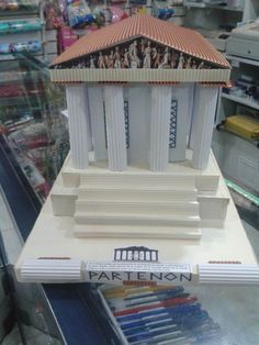 a model of the parthenon on display in a store